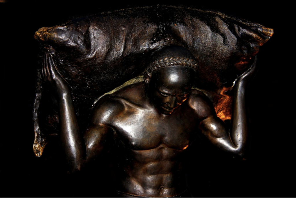 bronze sculpture: man lifting burden over head