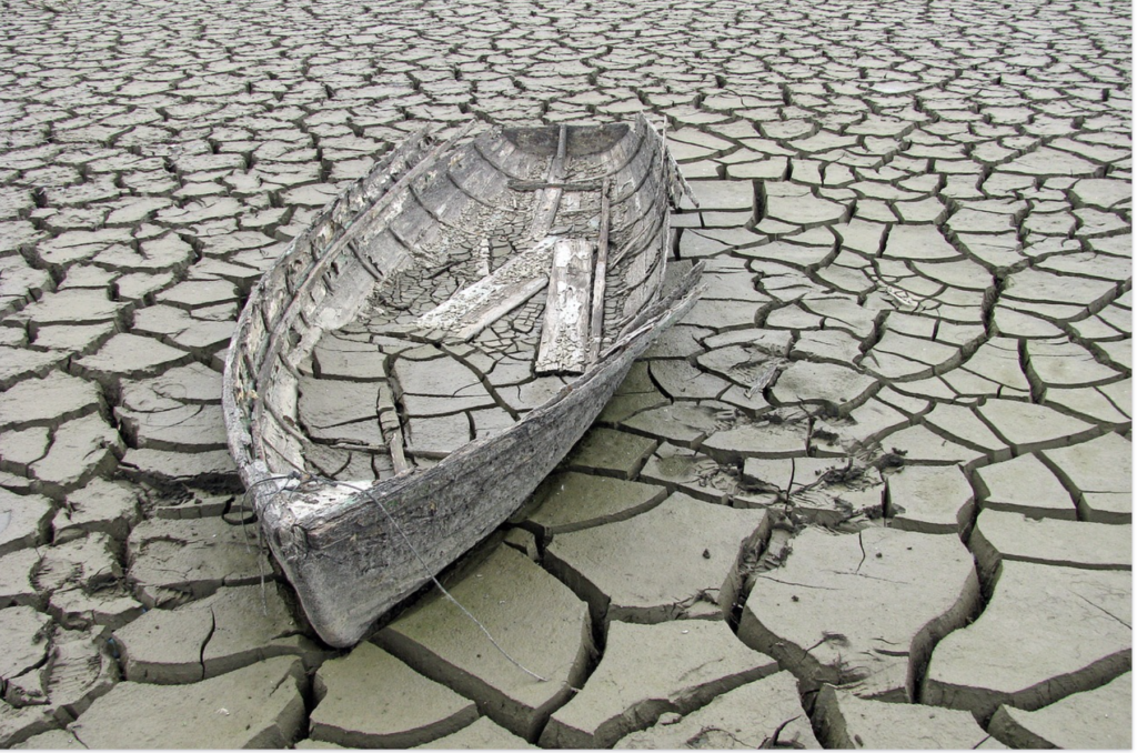 old boat on cracked mud